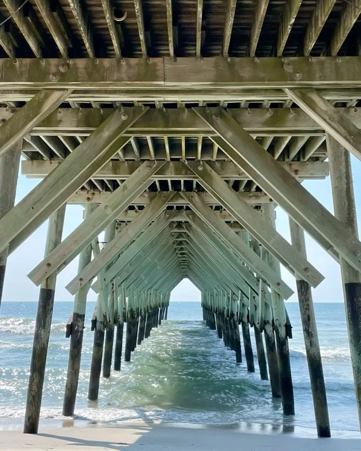 Looking out from under a pier on the North Carolina coast